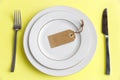 Serving plate, spoon, fork, knife and red napkin Royalty Free Stock Photo