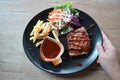 Pork steak, French fries and salad