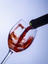 Serving a single glass of red wine from a bottle Royalty Free Stock Photo