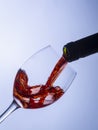 Serving a single glass of red wine from a bottle Royalty Free Stock Photo