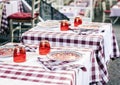 Serving on the table on terrace in the restaurant in Catania, Sicily, Italy, setting for diner Royalty Free Stock Photo