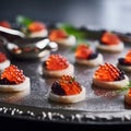 Serving tray with canape with red and black caviar close up. Gourmet food, delicacy appetizer. Delicatessen. Texture of caviar.