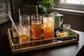 serving tray with iced teas and coffees, glassware, and straws