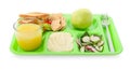 Serving tray with tasty healthy food and juice isolated on white. School dinner Royalty Free Stock Photo