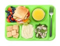 Serving tray with tasty healthy food and juice isolated on white, top view. School dinner Royalty Free Stock Photo