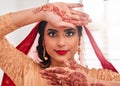 Serving up some serious bridal makeup inspiration. Portrait of a beautiful young woman covering her face with her hands Royalty Free Stock Photo