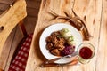 Serving of wild venison goulash with deer antlers Royalty Free Stock Photo