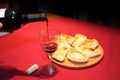 Wine served in a glass with empanadas Royalty Free Stock Photo