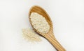 Sesam Seeds With wooden spoon on white background Royalty Free Stock Photo