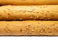 Sesame biscuits on a white background. Biscuits are elongated in the form of sticks. Bread products. Flour products. Lots of Royalty Free Stock Photo