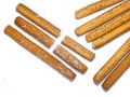 Sesame biscuits on a white background. Biscuits are elongated in the form of sticks. Bread products. Flour products. Healthy food Royalty Free Stock Photo