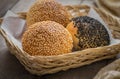 Sesame buns in wicker basket Royalty Free Stock Photo