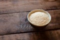 Sesame in clay bowl on wooden background Royalty Free Stock Photo
