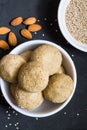 Sesame dessert or Til Ke Ladoo or Til laddu,an Indian sweet,isolated on black background.Top view,closeup.