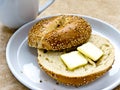Sesame Seed Bagel with Butter Royalty Free Stock Photo