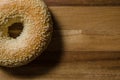 Sesame seed bagel on wood Royalty Free Stock Photo
