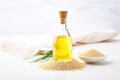 sesame seed oil in a glass bottle with raw sesame seeds Royalty Free Stock Photo