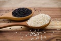 Sesame seed in wooden spoon. Black and white sesame set up on wo