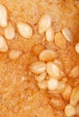 Sesame seeds on a brown crust of bread Royalty Free Stock Photo