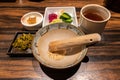 Sesame seeds inside a wooden mortar and pestle. Royalty Free Stock Photo