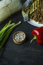 Sesame seeds in a wooden bowl. Roasted sesame seeds. Raw, whole, unprocessed. Natural light. Selective focus. Dark wooden