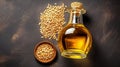 Sesame vegetable oil with grains and fields background, vegetarian dressing for salads and cooking.