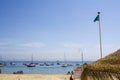 Beach with green flag for safe swimming