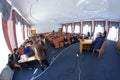 Session of regional council. Deputies sitting in a hall, speaker keeping speach at the tribune, head and his assistants sitting at