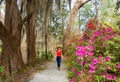 Smiling happy girl walking in beautiful garden on spring trip. Royalty Free Stock Photo