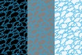 Set of abstract textures. Three seamless patterns with cracked black, grey, white polygonal forms on a blue background. Royalty Free Stock Photo