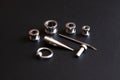 Set of accessories for piercing on a dark background Royalty Free Stock Photo