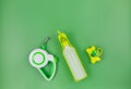 Set of accessories for walking your dog: leash, bottle for water, dog cleaning bags on green background. Pet care and training