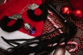 A set of adult BDSM toys with Christmas decor. Flatley. Example of a gift. Handcuffs, whip, anal plug, Christmas balls. Royalty Free Stock Photo