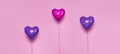 Set of Air Balloons. Bunch of pink color heart shaped foil balloons isolated on pink background. Love. Holiday celebration. Royalty Free Stock Photo