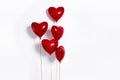 Set of Air Balloons. Bunch of red color heart shaped foil balloons isolated on white background. Love.