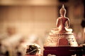 Back buddha statue placed on the altar table in hall room Royalty Free Stock Photo