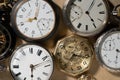 A set of antique gold and silver American and Swiss pocket watches with markings. Retro mechanical watch with white Royalty Free Stock Photo