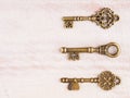 Set of antique keys on wooden background Royalty Free Stock Photo