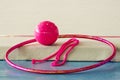 Set of apparatus for rhythmic gymnastics in pink color ball, hoop Royalty Free Stock Photo