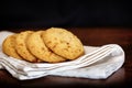 Set of apple chip cookies on white napkin