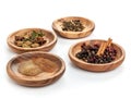 set of aromatic spices on wooden plates on white background Royalty Free Stock Photo