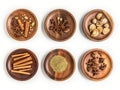 set of aromatic spices on wooden plates on white background Royalty Free Stock Photo