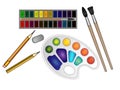 Set of art materials, stationery, watercolor paints and brushes, a palette of paints, an eraser and pencils. Royalty Free Stock Photo