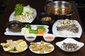 Set of Asia sea food with Coconut Escargot, barbecue razor clam, cheese grilled oyster, boiled vegetable eating with braided fish