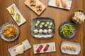 set of asian food dishes with sushi, avocado maki, shrimp noodles, edamame Royalty Free Stock Photo