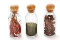 Set of assorted colorful spices in glass bottle isolated