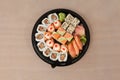 Set of assorted sushi kept in a black round box Royalty Free Stock Photo