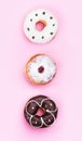 Set of assorted sweet donuts isolated on pink background. Concept of pastry, top view Royalty Free Stock Photo