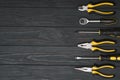 Set of assorted work carpentry and locksmith tools on a dark wooden background with copy space Royalty Free Stock Photo