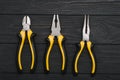 Set of assorted work carpentry and locksmith tools on a dark wooden background with copy space Royalty Free Stock Photo